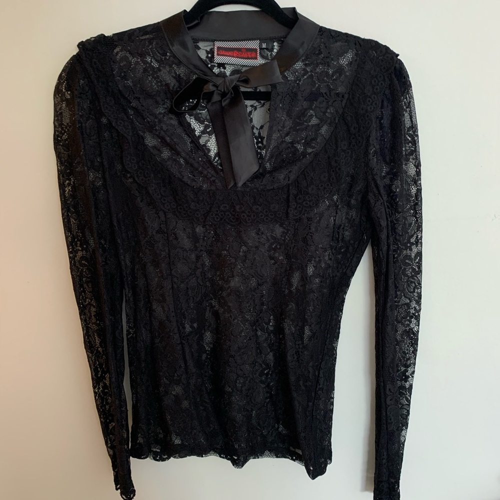 Black lace blouse with bow.